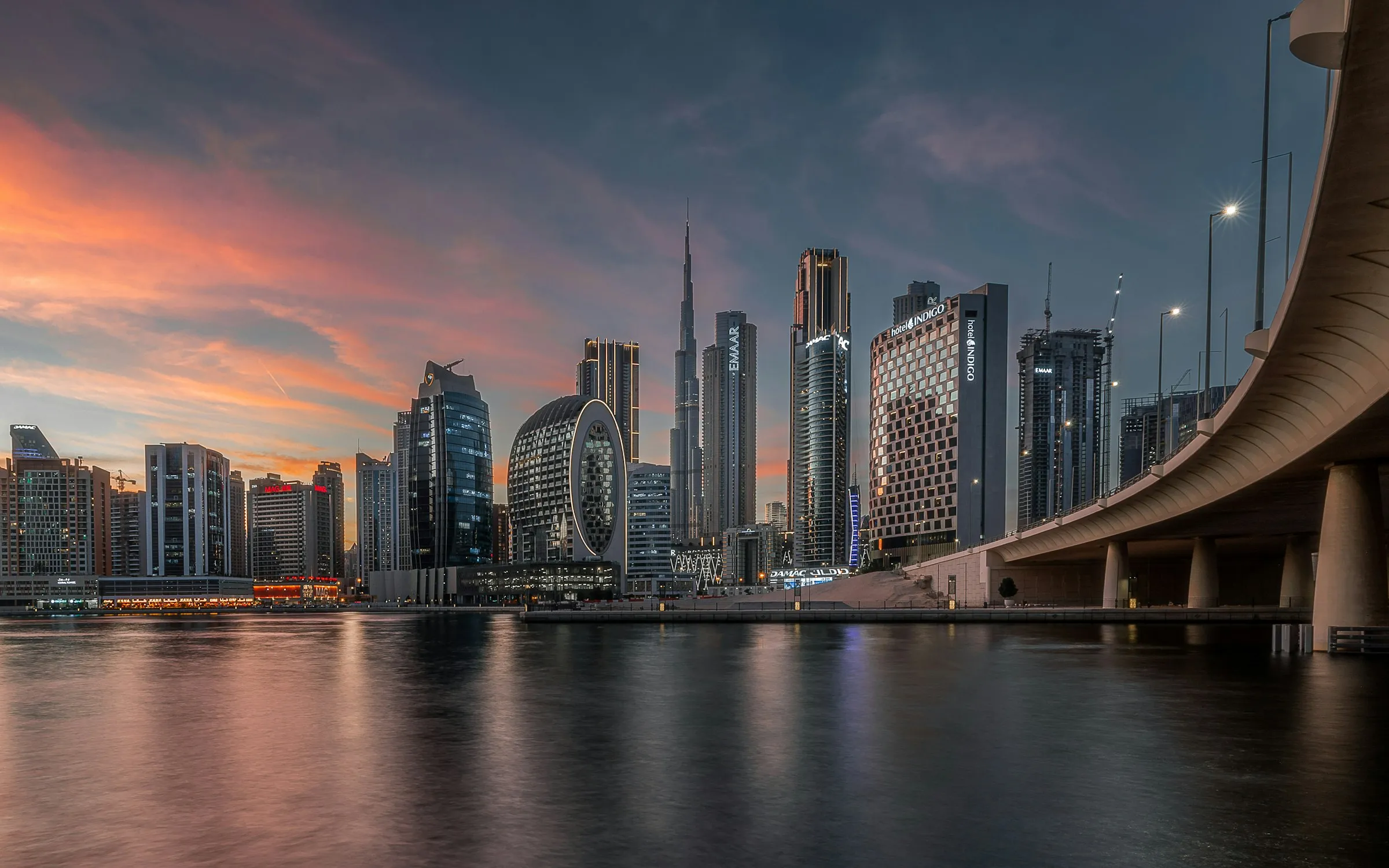 Dubai Water Canal and Business Bay towers at sunset