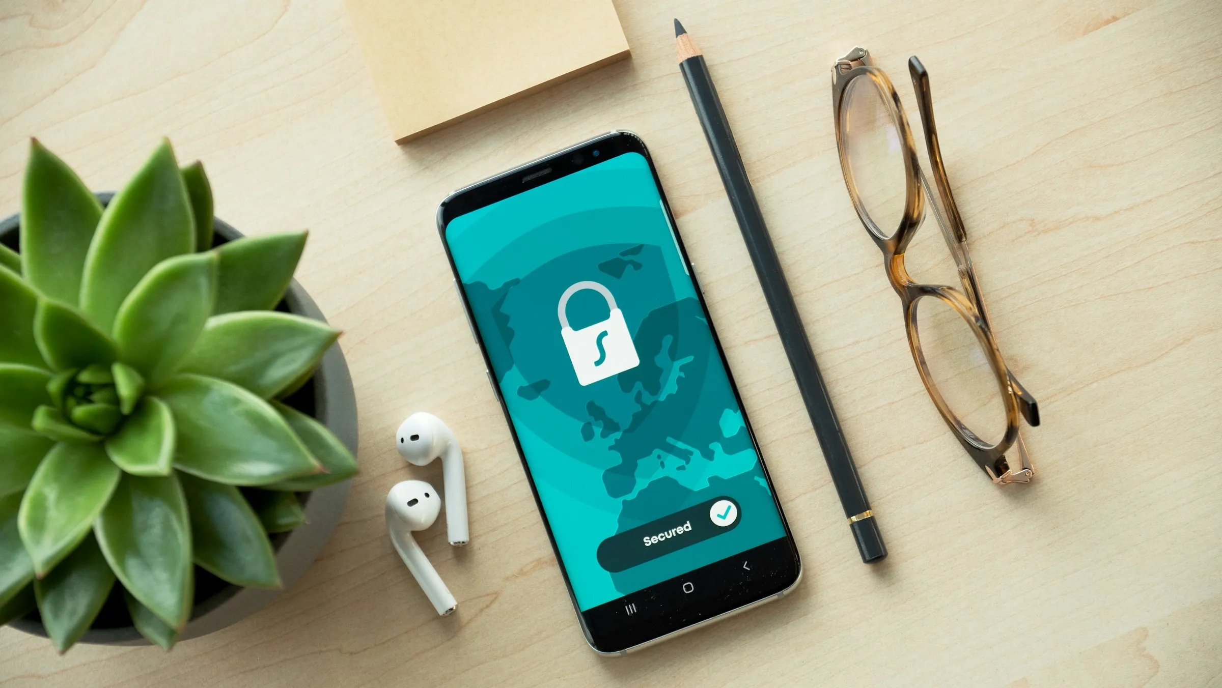Phone showing a secure padlock screen on a desk