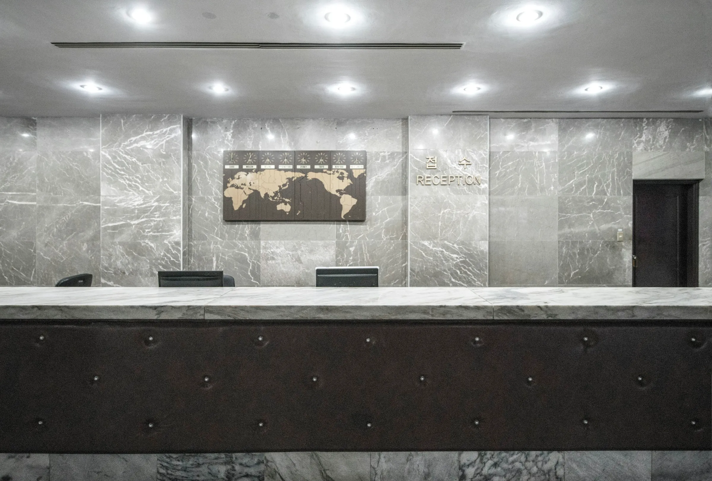 Marble reception desk in an office lobby