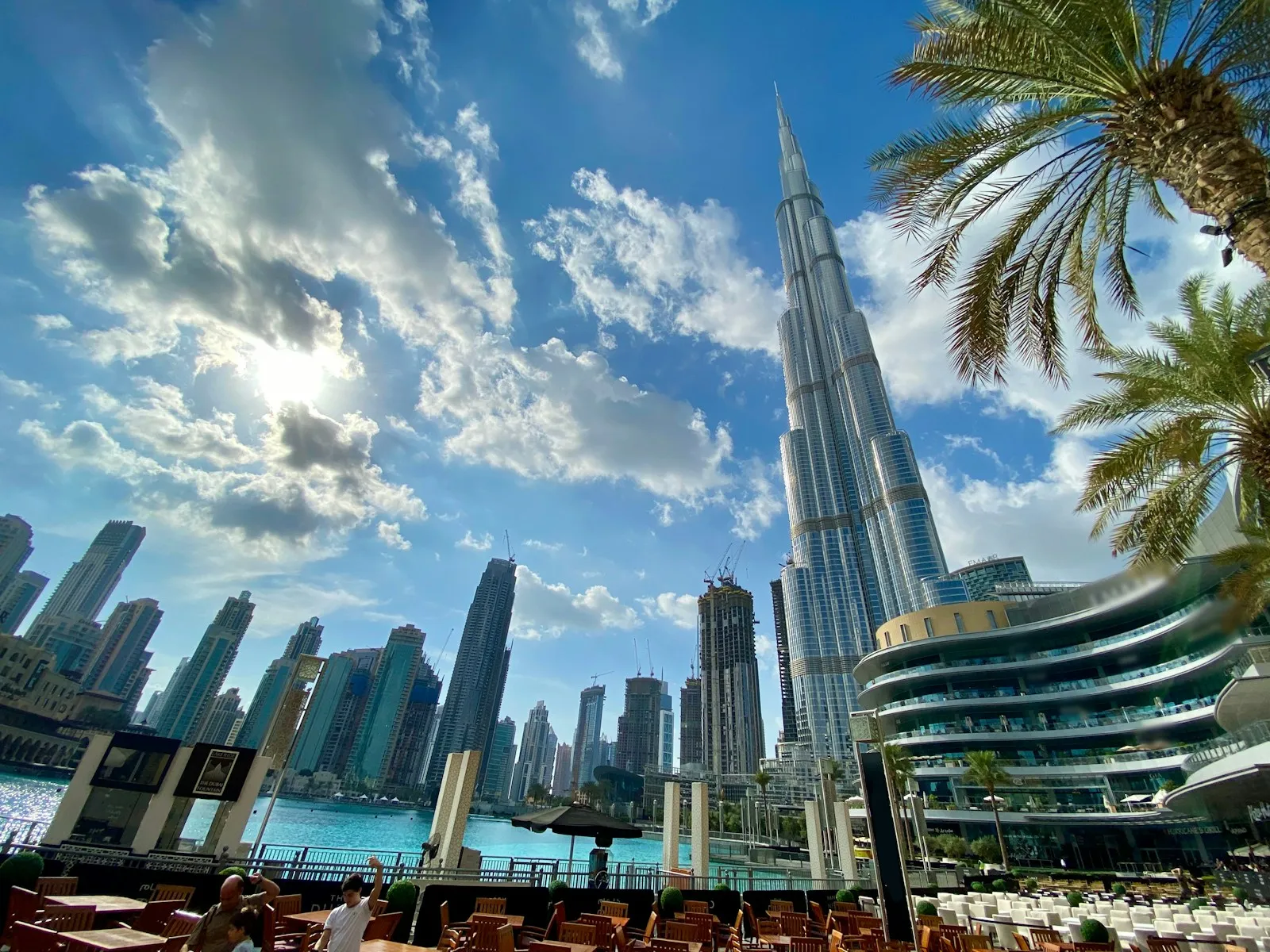 Burj Khalifa and Downtown Dubai towers under a bright sky